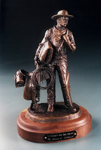 cowboy holding a saddle